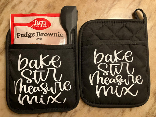Bake Stir Measure Mix Gift Set with Message in White on 2 Black Pot Holders, 1 Dessert Mix, 1 Spatula or Spoon.