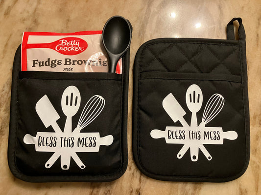 Bless This Mess Gift Set with Message in White on 2 Black Pot Holders, 1 Dessert Mix, 1 Spatula or Spoon.